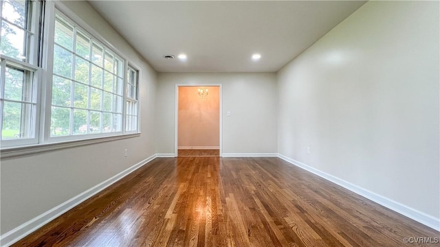 spare room featuring dark hardwood / wood-style flooring