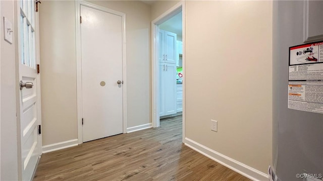 hall with light hardwood / wood-style flooring