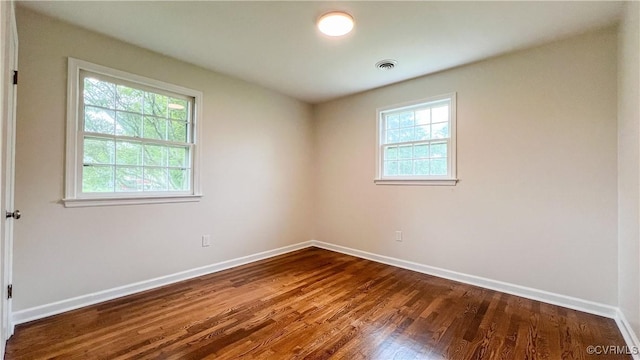 empty room featuring wood-type flooring