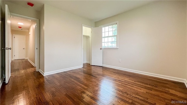 unfurnished room featuring dark hardwood / wood-style floors