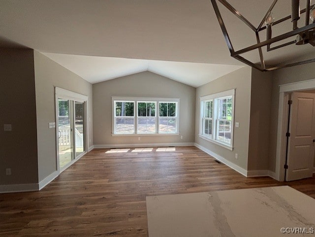 TBD1 Park St, Ashland, VA 23005 - unfurnished living room with wood finished floors and vaulted ceiling