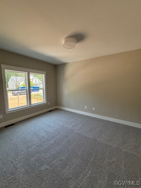 TBD1 Park St, Ashland, VA 23005 - unfurnished room with baseboards and dark carpet