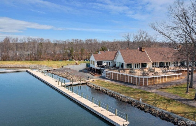 back of house with a water view