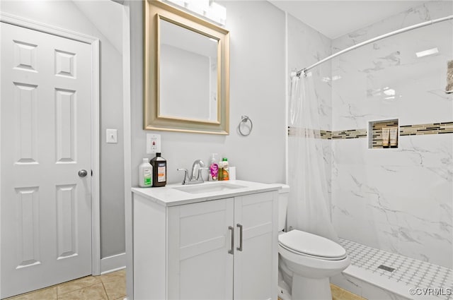 bathroom featuring a shower with curtain, vanity, toilet, and tile patterned floors