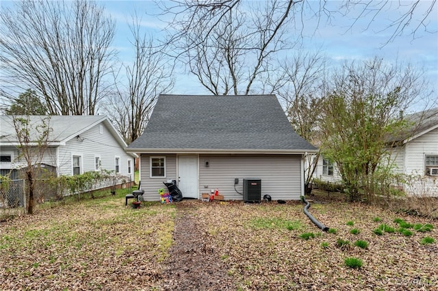 rear view of property featuring central air condition unit