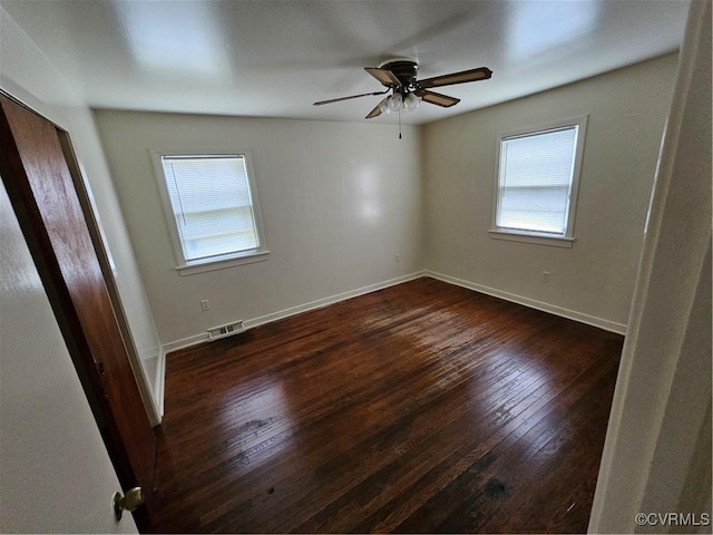 unfurnished room featuring ceiling fan and dark hardwood / wood-style flooring