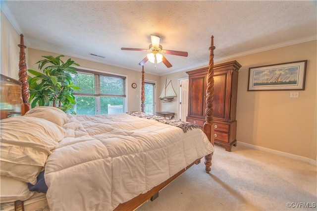 bedroom featuring a textured ceiling, ceiling fan, crown molding, and light carpet