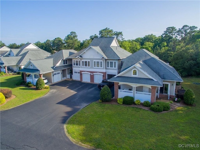 view of front of house with a garage and a front lawn