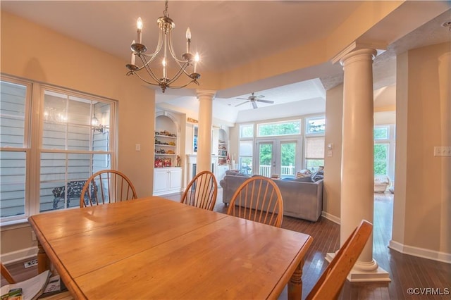 dining area with built in shelves, ornate columns, ceiling fan with notable chandelier, and french doors