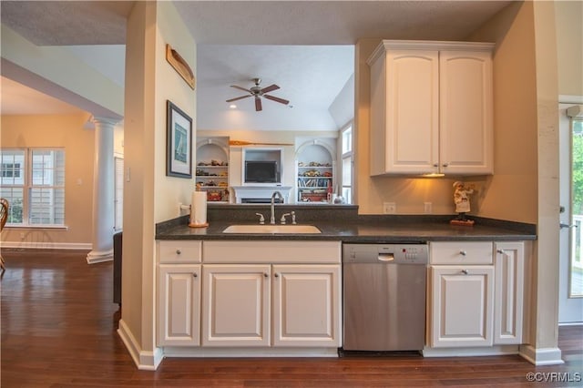 kitchen featuring dishwasher, white cabinets, sink, ceiling fan, and ornate columns