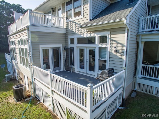 wooden terrace featuring french doors, grilling area, and central AC