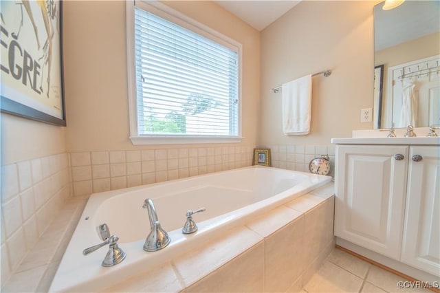 bathroom with vanity, tiled bath, and tile patterned floors