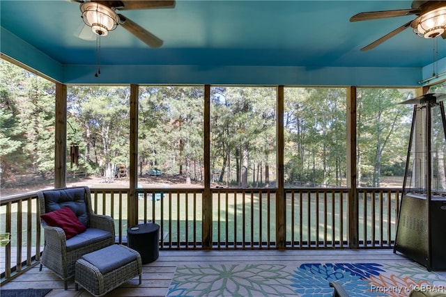 sunroom / solarium with ceiling fan and a wealth of natural light