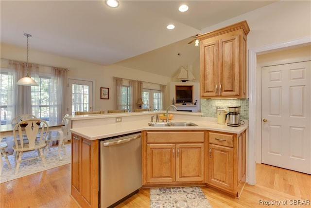 kitchen featuring dishwasher, sink, light hardwood / wood-style flooring, tasteful backsplash, and kitchen peninsula