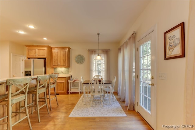 dining area featuring light wood-type flooring