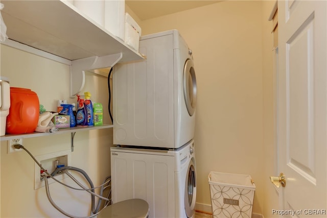 washroom with stacked washer and dryer