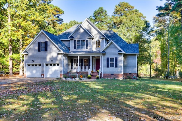 craftsman house featuring covered porch, a garage, and a front lawn