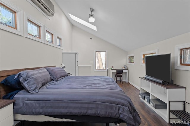 bedroom with ceiling fan, lofted ceiling with skylight, dark wood-type flooring, and a wall unit AC