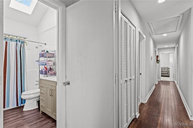 hall with dark hardwood / wood-style floors