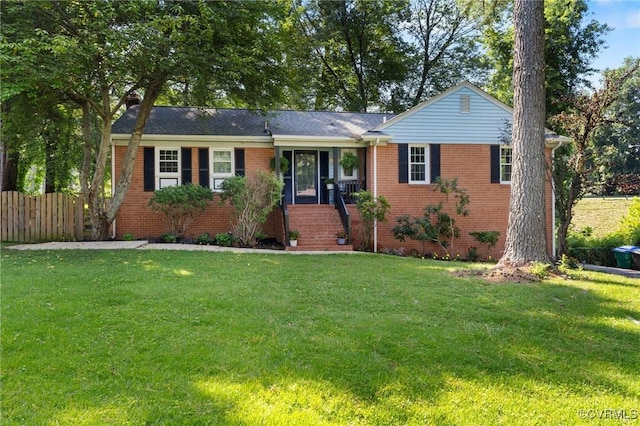 single story home featuring a front lawn