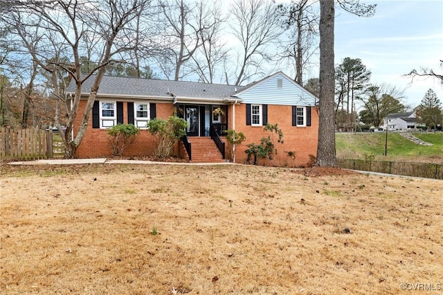 ranch-style home with a front lawn