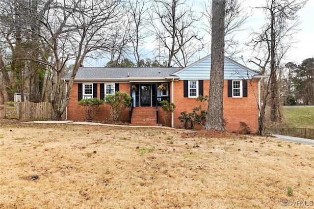 single story home with a front yard