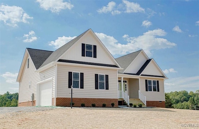 view of front of house featuring covered porch and a garage