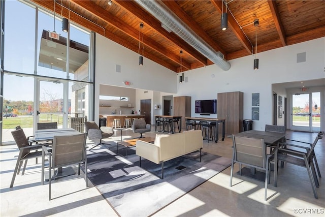 living room featuring beamed ceiling, wooden ceiling, and high vaulted ceiling