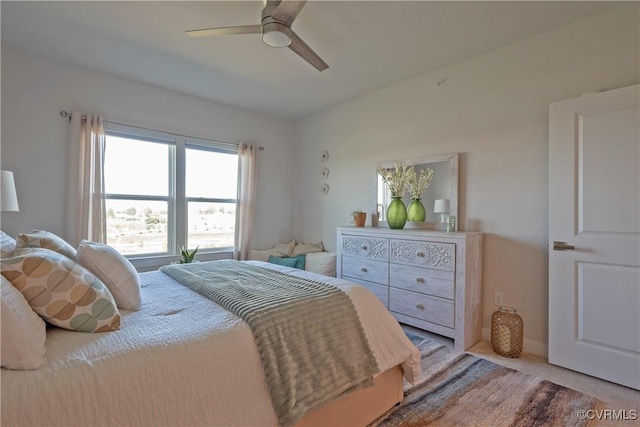 bedroom with ceiling fan and carpet