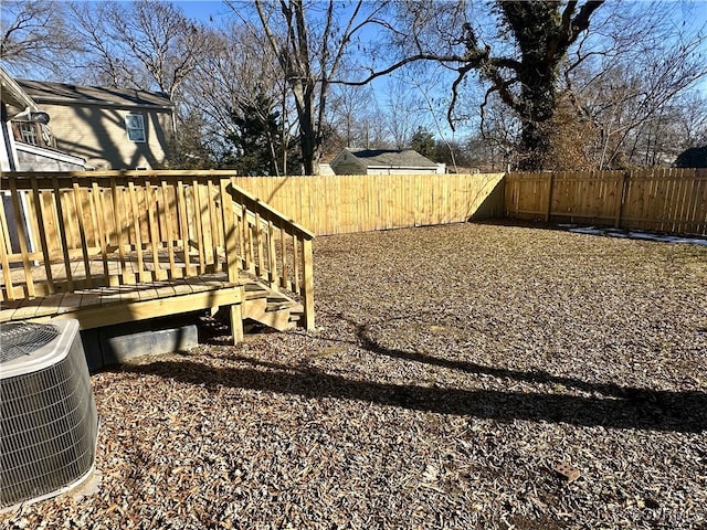 view of yard with a deck and cooling unit