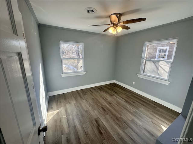 unfurnished room with ceiling fan, crown molding, and dark hardwood / wood-style floors