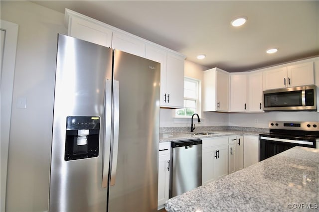2625 Butterbean Ct, Henrico, VA 23231 - kitchen with stainless steel appliances, a sink, white cabinets, light stone countertops, and recessed lighting