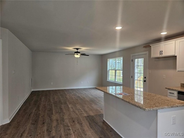 kitchen featuring dark wood finished floors, recessed lighting, a kitchen island, white cabinets, and a ceiling fan