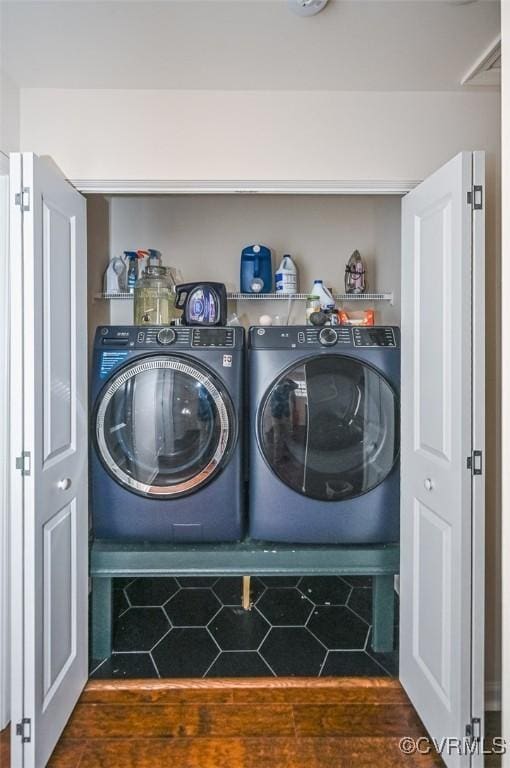 laundry area featuring washing machine and clothes dryer