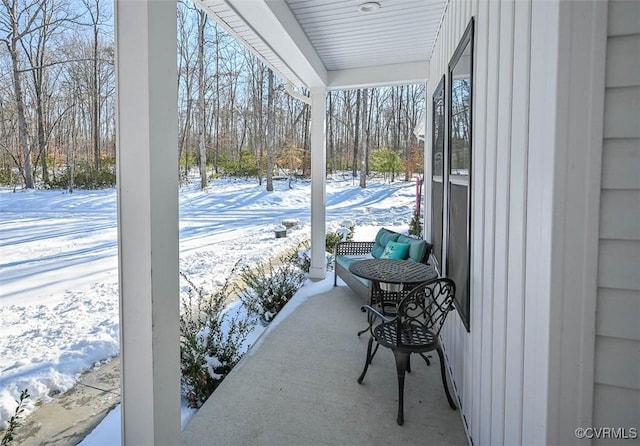 view of snow covered patio