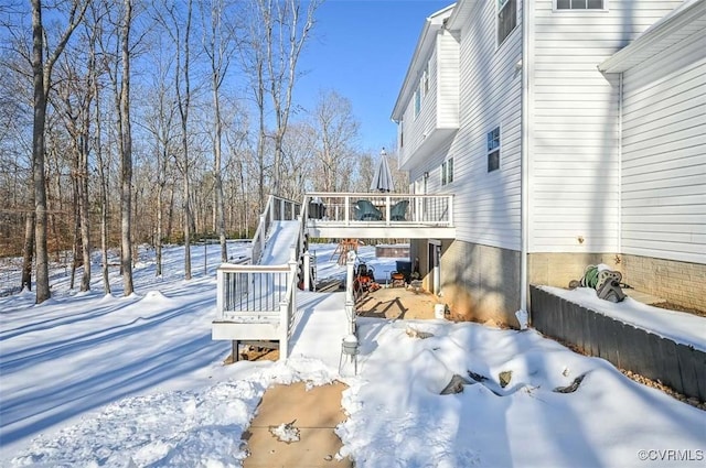 view of snow covered deck