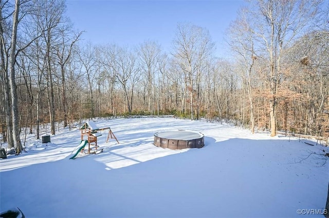 view of yard covered in snow