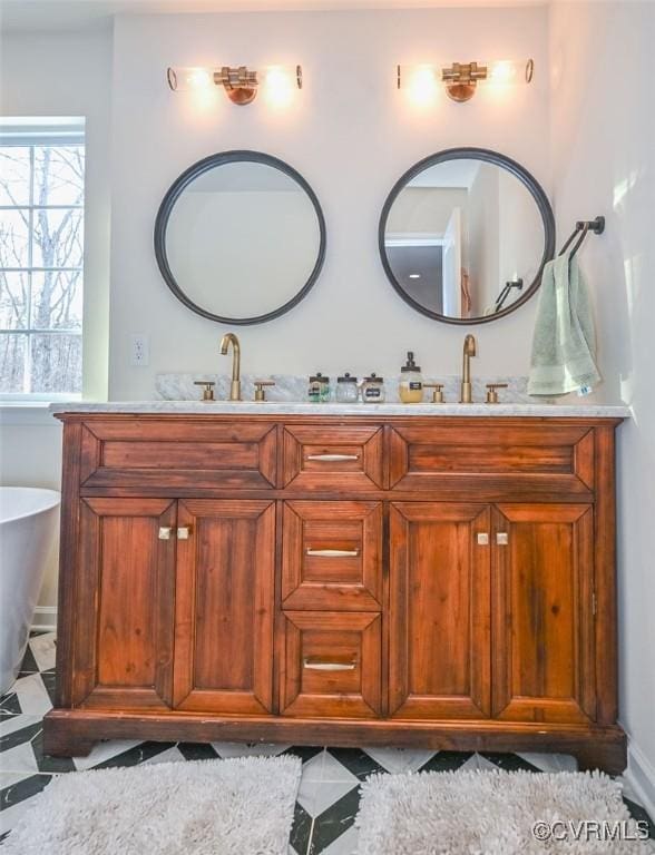 bathroom with vanity and a bathtub