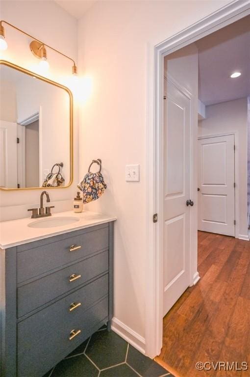 bathroom with vanity and hardwood / wood-style floors