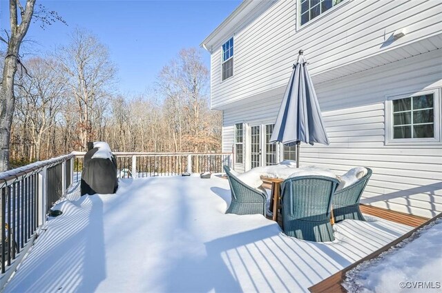 view of snow covered deck