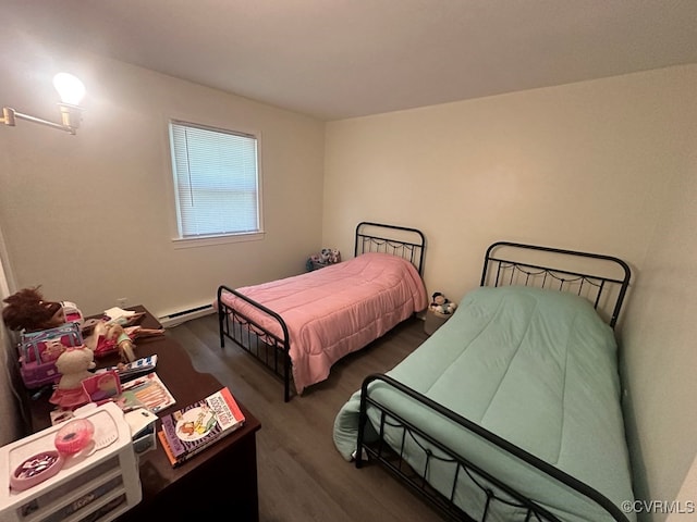 bedroom featuring dark hardwood / wood-style flooring and a baseboard radiator