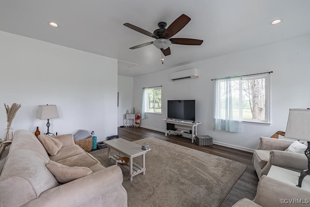 living room with dark hardwood / wood-style floors, a wall mounted AC, and ceiling fan