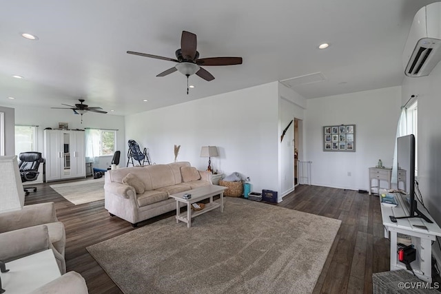 living room featuring dark hardwood / wood-style floors, an AC wall unit, and ceiling fan