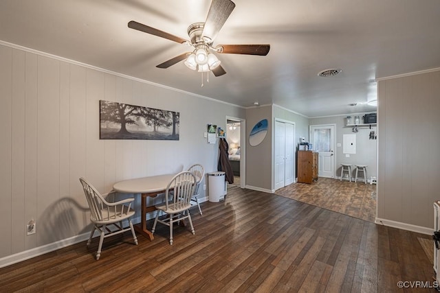 dining room featuring ceiling fan, dark hardwood / wood-style flooring, and ornamental molding