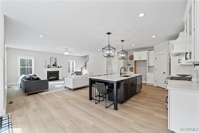 3900 New Kent Hwy, Quinton, VA 23141 - kitchen featuring a sink, white cabinetry, light wood-style floors, light countertops, and recessed lighting