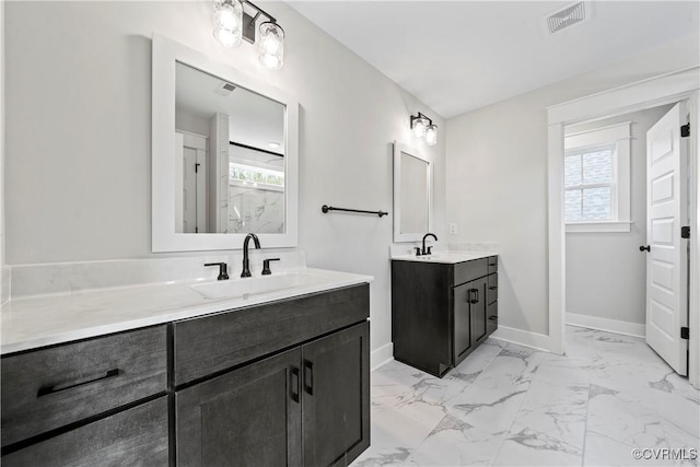 3900 New Kent Hwy, Quinton, VA 23141 - bathroom featuring marble finish flooring, plenty of natural light, baseboards, and two vanities