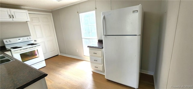 kitchen with light wood-type flooring, ornamental molding, white appliances, sink, and white cabinetry