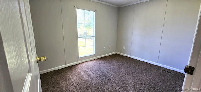 carpeted empty room featuring ornamental molding