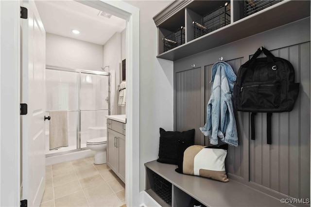 mudroom featuring light tile patterned flooring