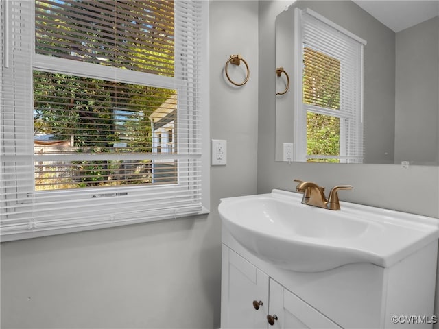 bathroom with vanity and a healthy amount of sunlight